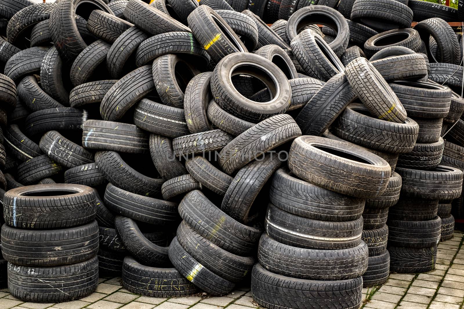 Sibiu, Romania - May 04, 2019. Used tire stacks in Workshop vulcanization yard