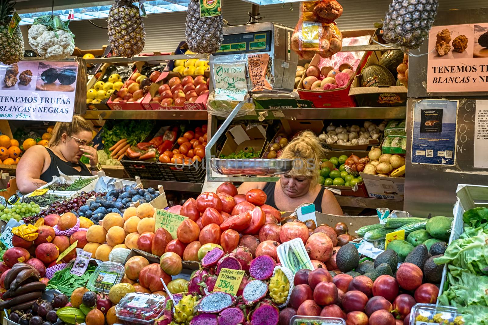 Malaga, Spain - August 04, 2018. The fresh fruit stand at the market of Ataranzanas Central Market, Malaga, Spain