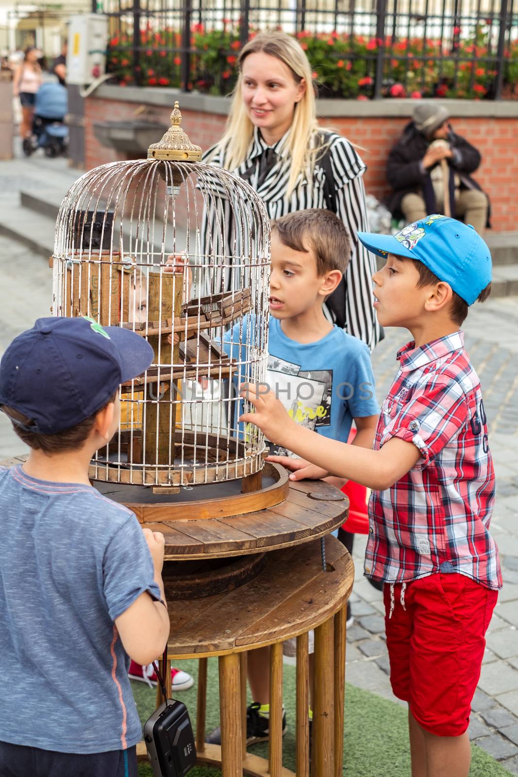 Sibiu City, Romania - 19 June 2019. children playing in The Strange Travel of Mr. Tonet from Spain, in the Big square, at the Sibiu International Theatre Festival from Sibiu, Romania.