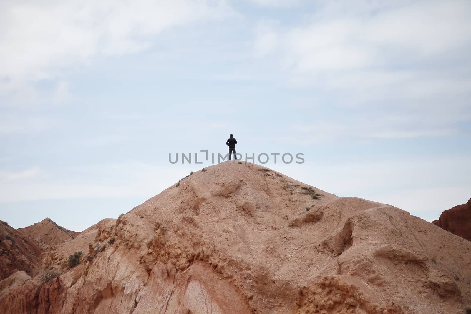 Man on the top of the mountain. Beautiful mountain landscape. Wildlife of Kyrgyzstan. Kyrgyzstan. High quality photo