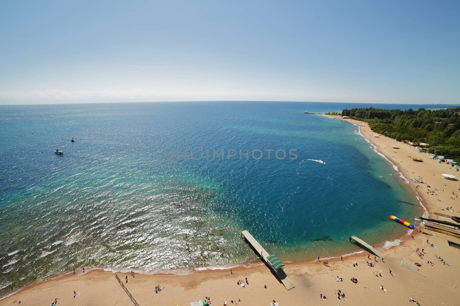 The coast of Lake Issyk-Kul. Blue water, shooting from above. by selinsmo