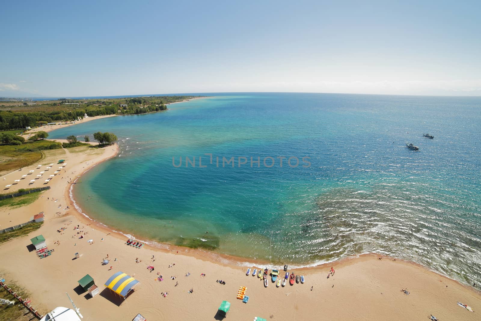 The coast of Lake Issyk-Kul. Blue water, shooting from above. High quality photo