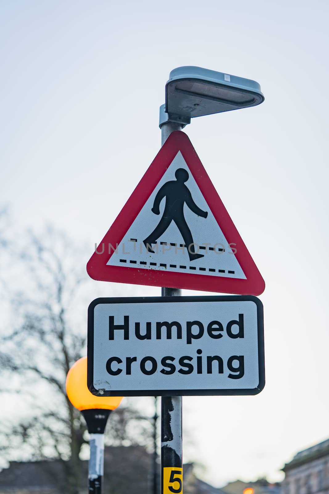 A humped crossing road sign in England