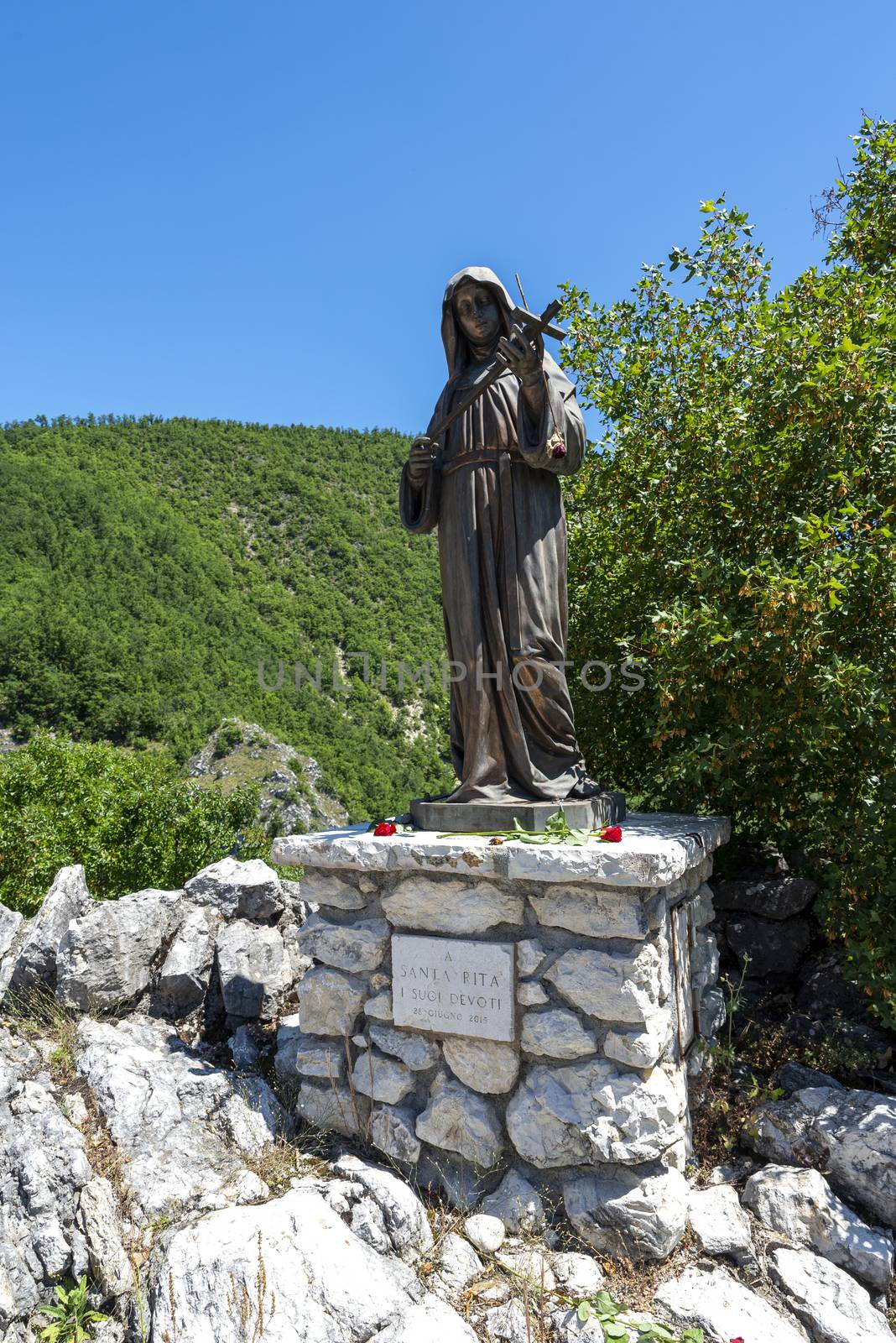 rocca porena,italy july 05 2020:monument of santa rita near the sanctuary of the rock in rocca porena where santa rita precava