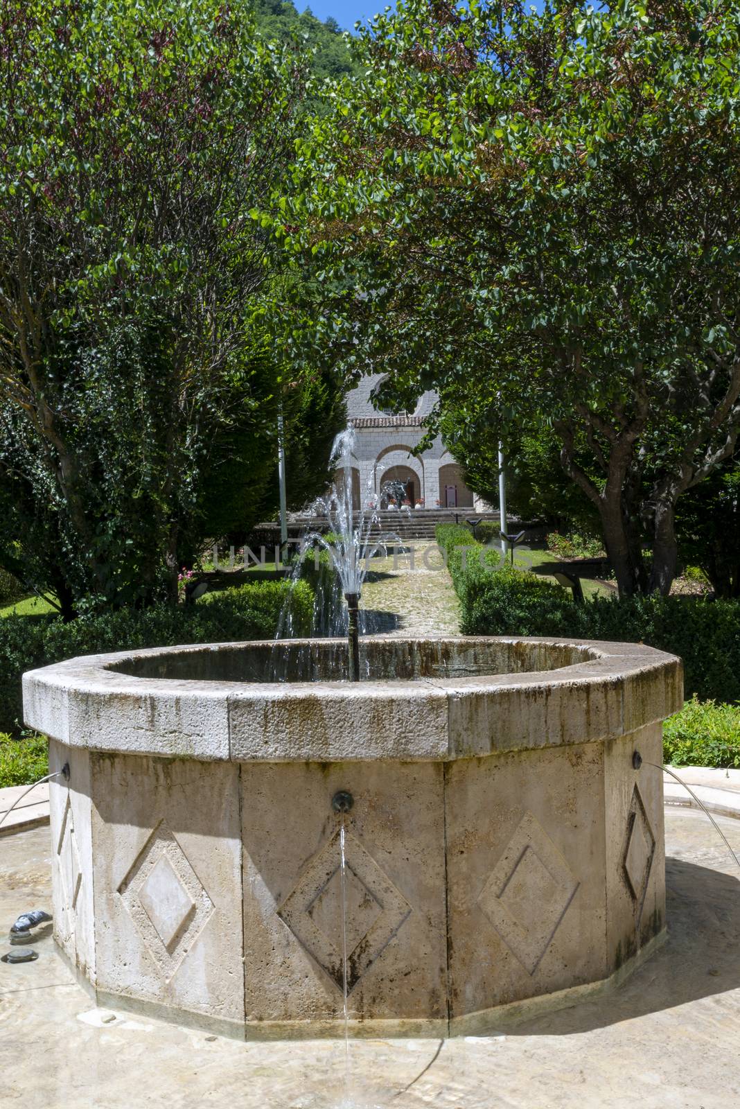 rocca porena,italy july 05 2020:fountain in the garden of the sanctuary of rocca porena