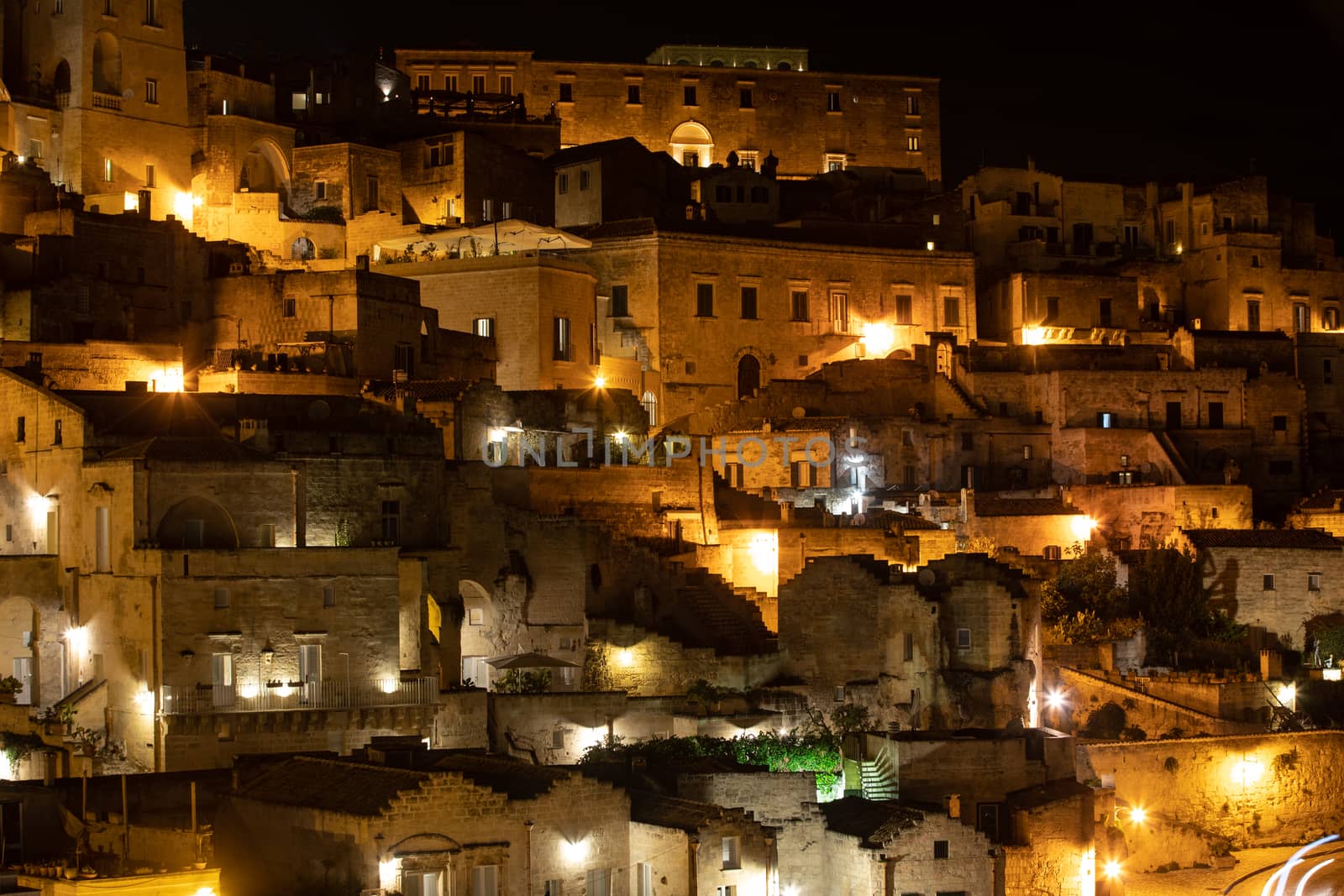 Amazing lighted buildings in ancient Sassi district by night in Matera,  Basilicata. Italy by wjarek