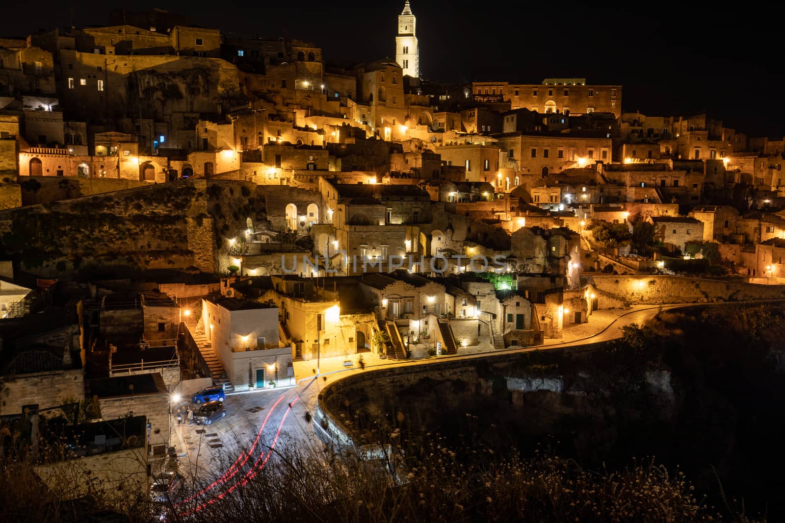 Amazing lighted buildings in ancient Sassi district by night in Matera, Basilicata. Italy by wjarek