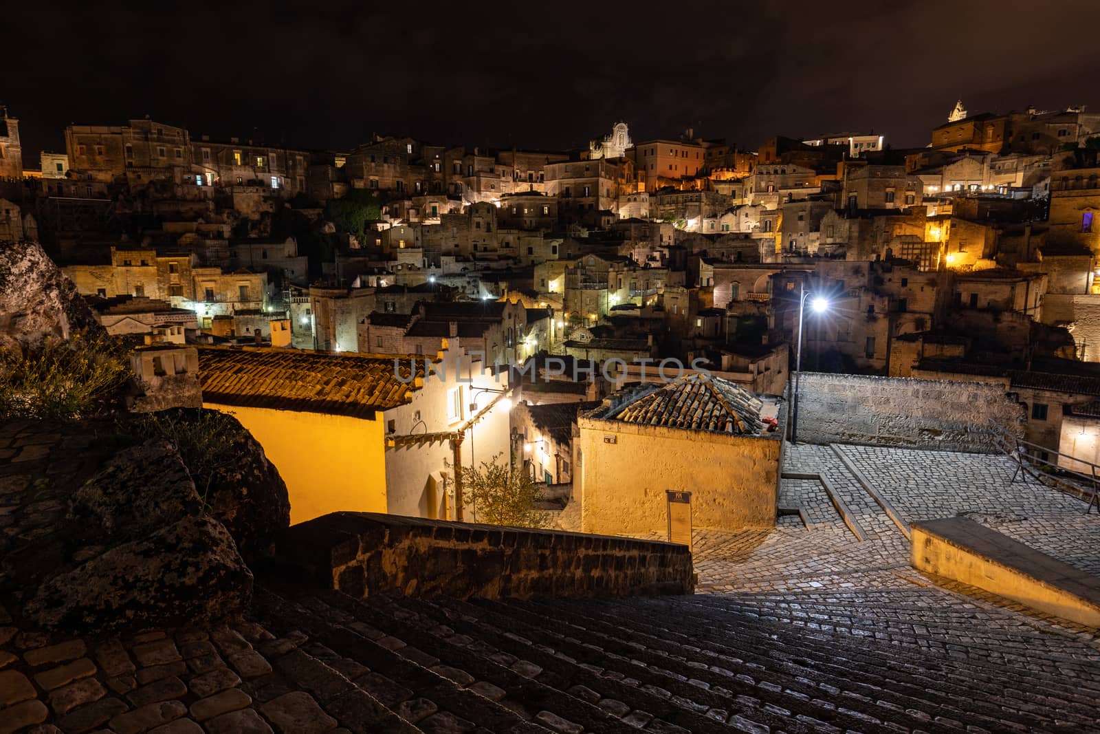 Amazing lighted buildings in ancient Sassi district by night in Matera, Basilicata. Italy by wjarek