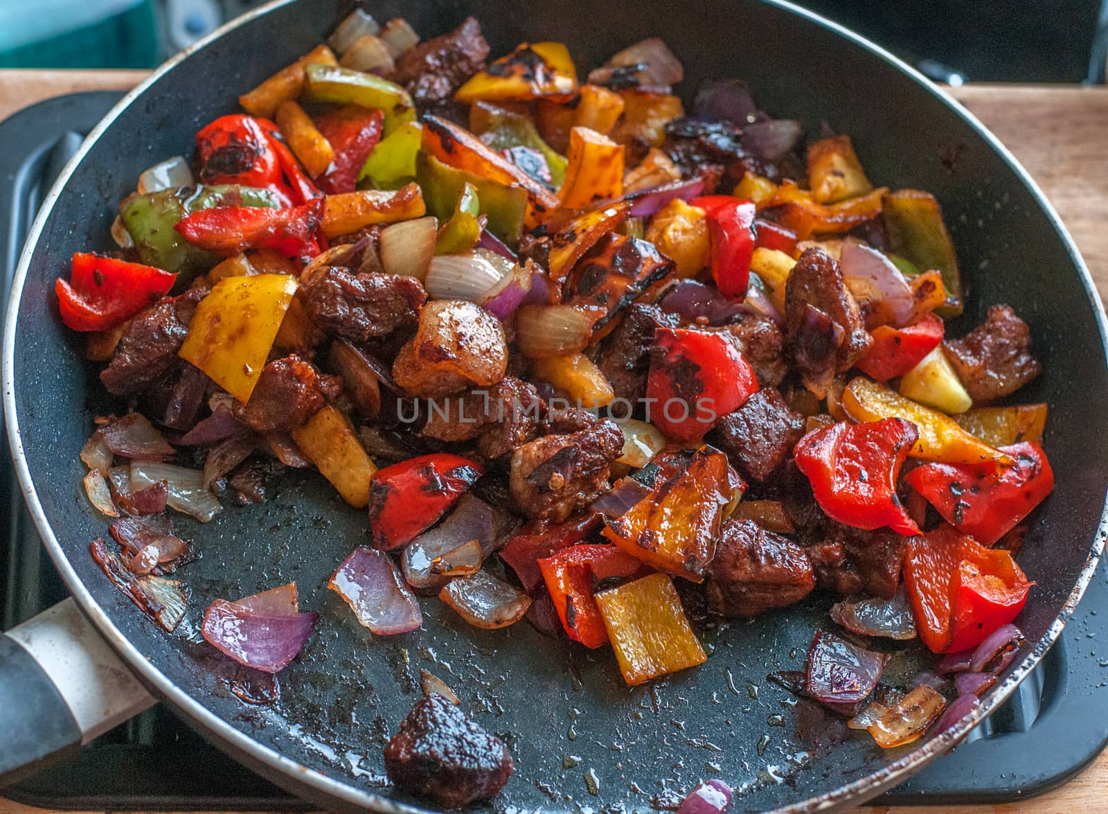 cooked stir fry in a pan by sirspread