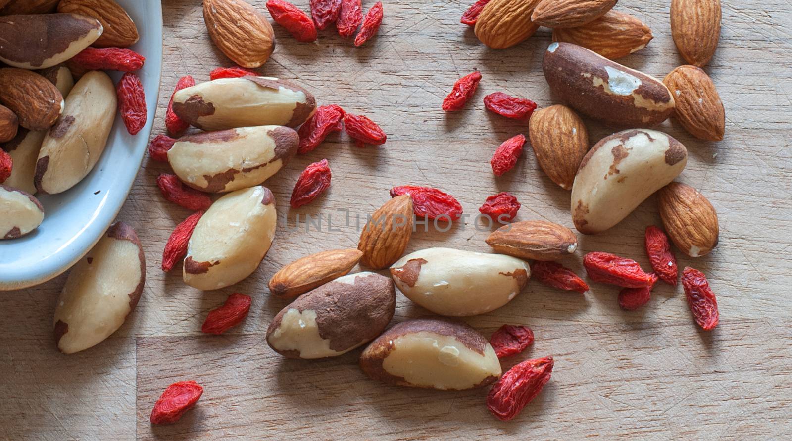 brazil nuts almond nuts and goji berries by sirspread