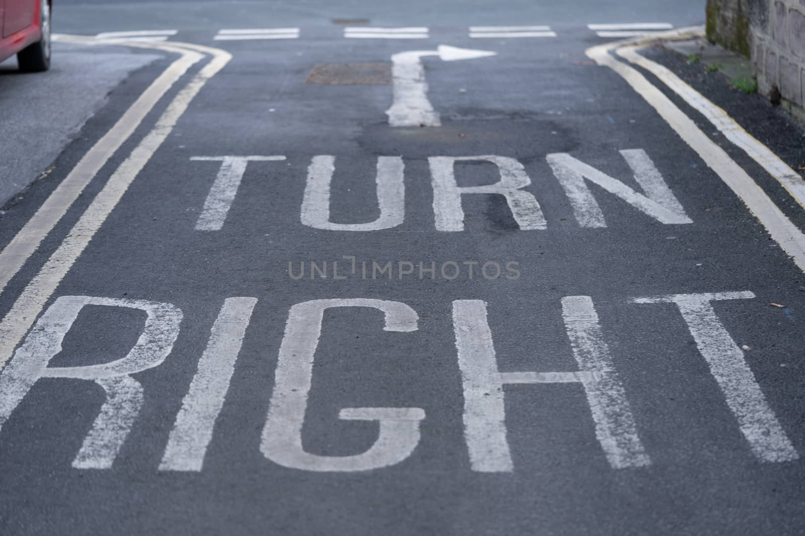 A Turn Right Arrow painted on the the tarmac in the UK
