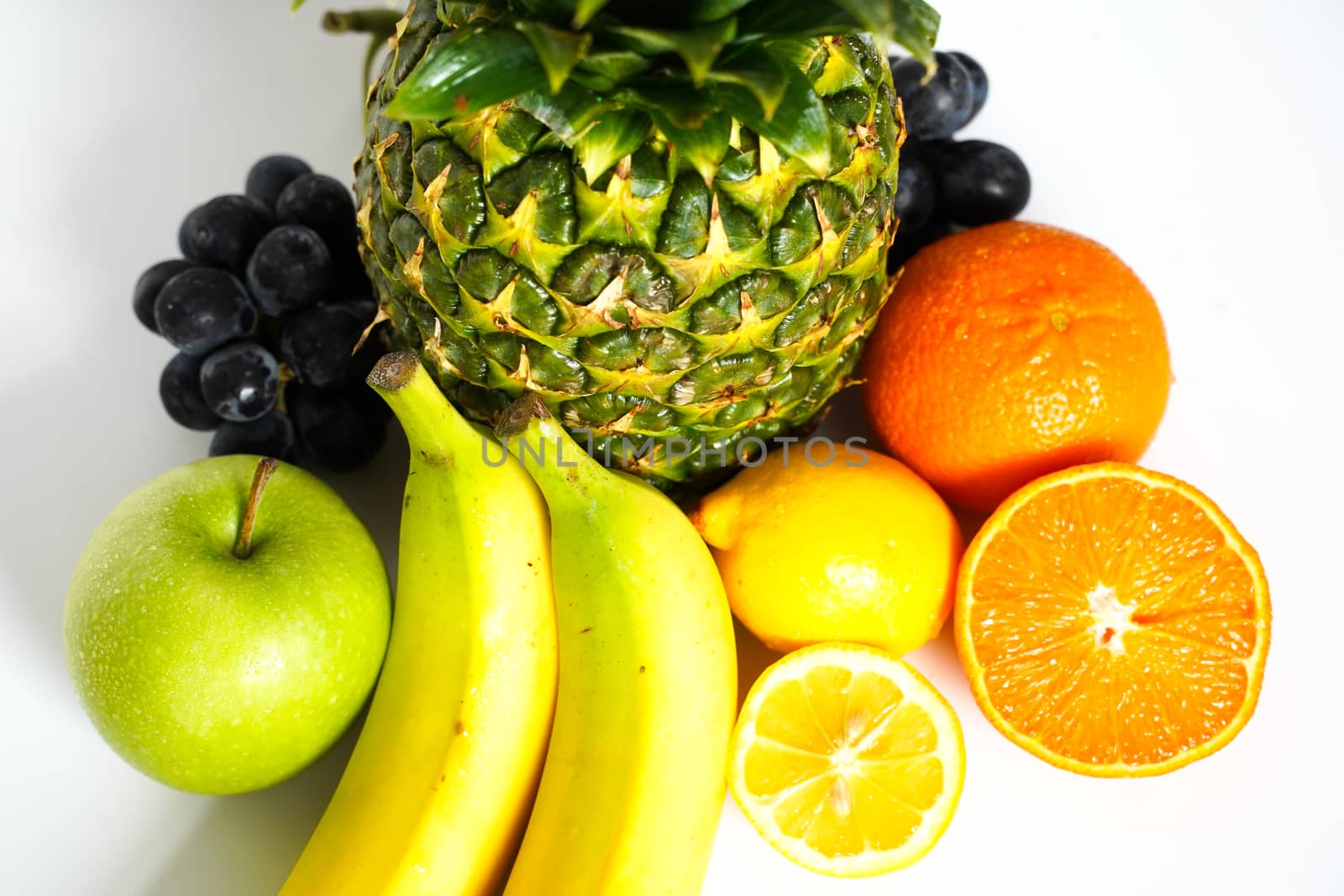 A selection of tropical fruit against a plain white background