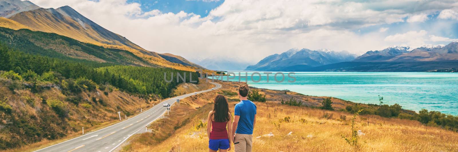 New Zealand travel people looking at Mount Cook Aoraki far in the landscape. Couple tourists walking at Peter's lookout, banner panorama copy space on background by Maridav