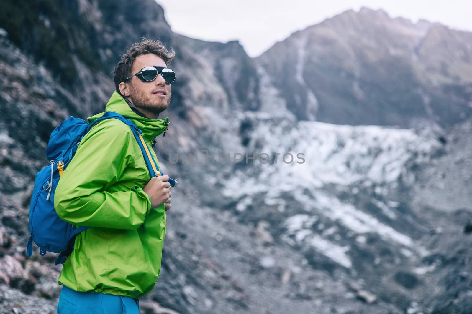 Travel adventure in New Zealand. Tourist explorer backpacking in nature landscape by Franz Josef Glacier, Westland Tai Poutini National Park, South Island, New Zealand.