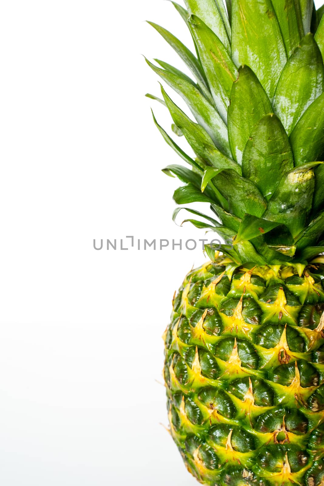 A whole pineapple against a plain white background