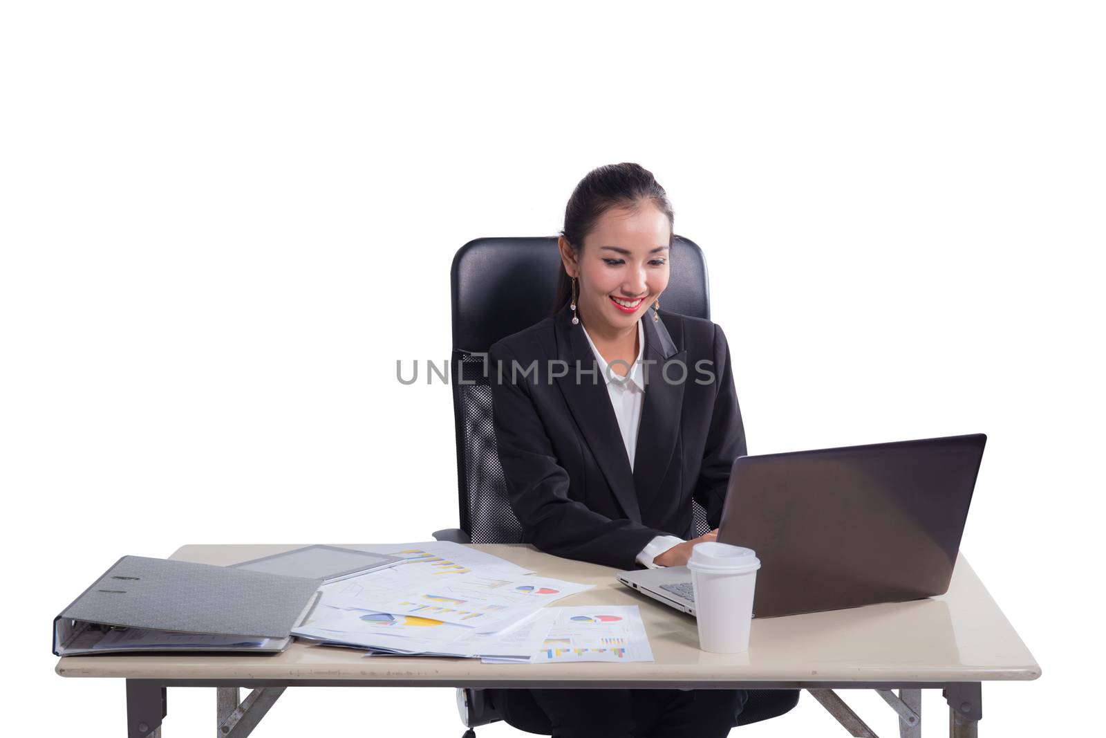 Young businesswoman working in office, typing, using computer. Concentrated woman searching information online