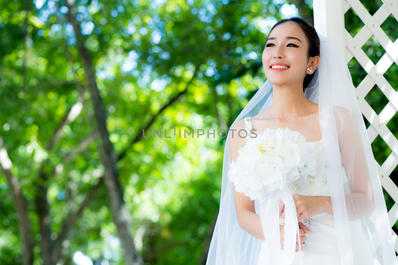 Asian bride at outdoor in a morning. by nnudoo