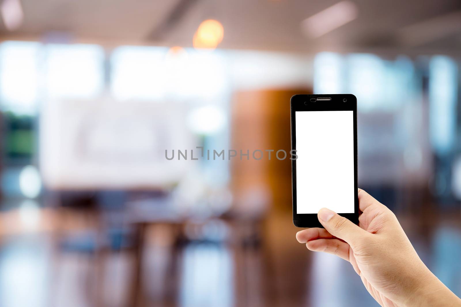 Mockup image of hand holding black mobile phone with blank white by nnudoo