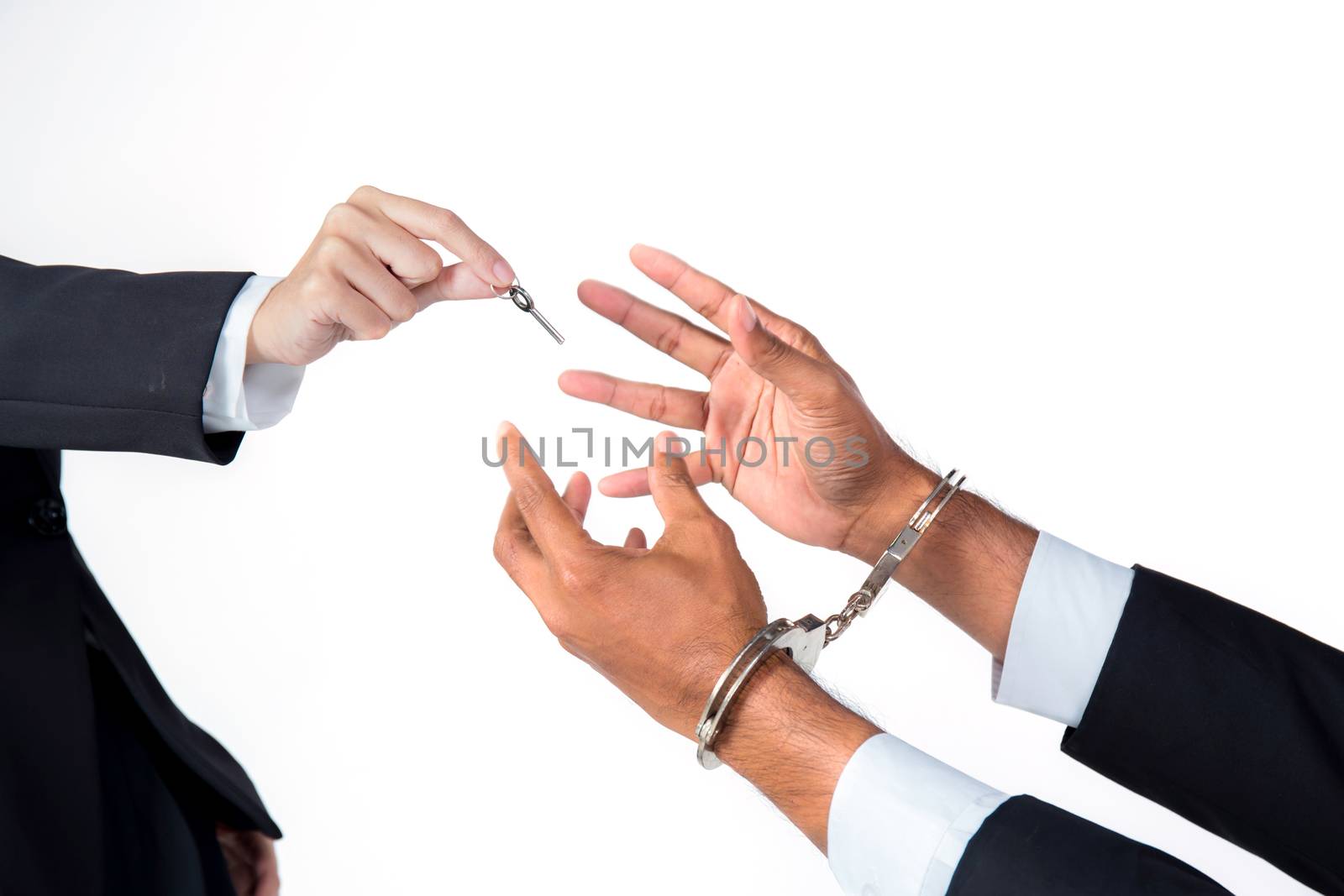 businessman in handcuffs and woman hand offering key solving bus by nnudoo