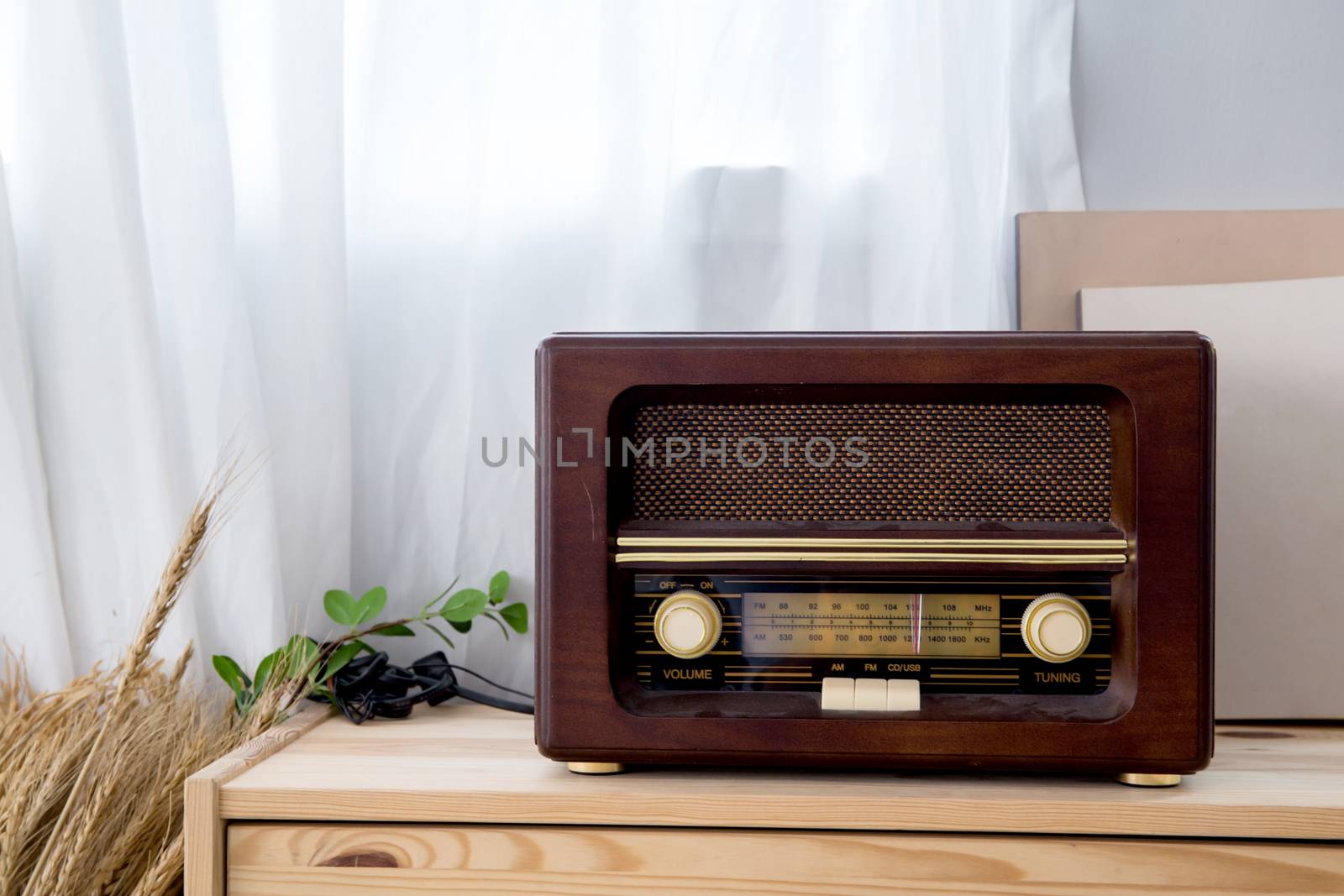 old vintage radio with shelf on the wooden cabinet.