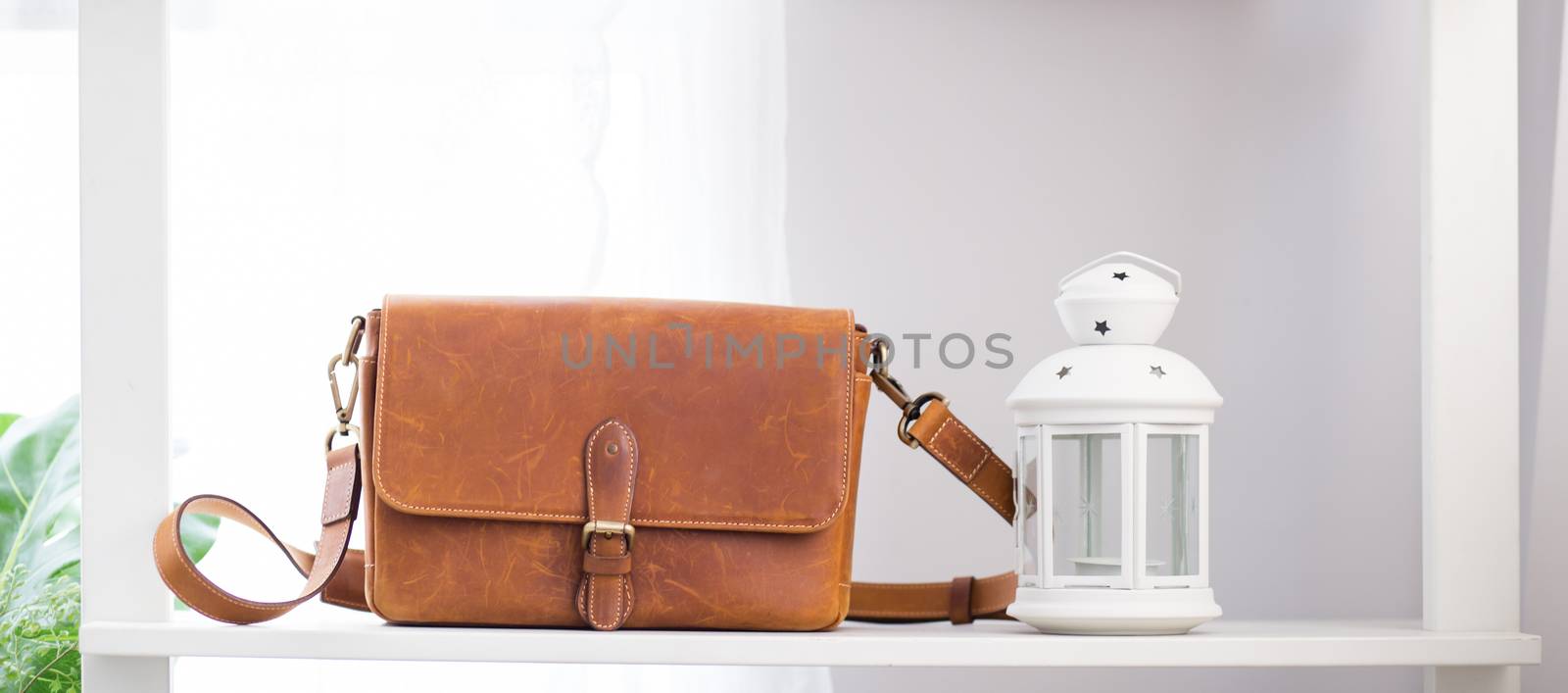 Fashion female handbag brown color on shelf