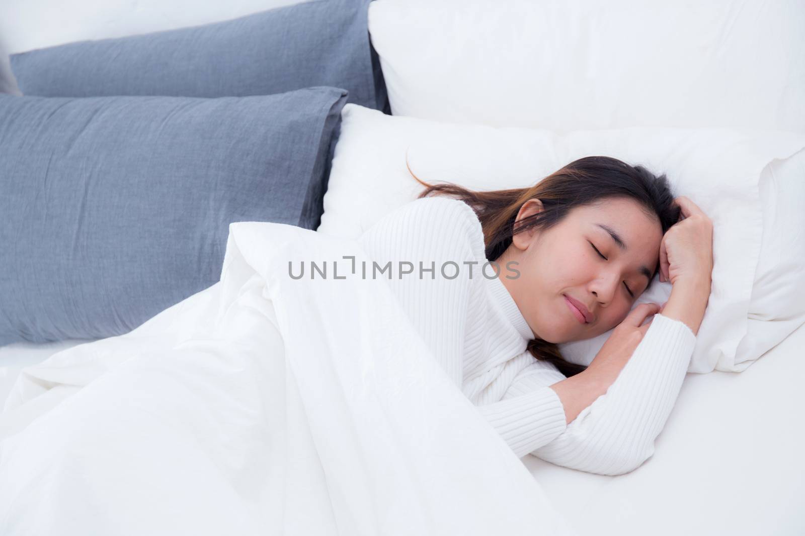 Beautiful girl on bed sleeping at home in the bedroom. by nnudoo