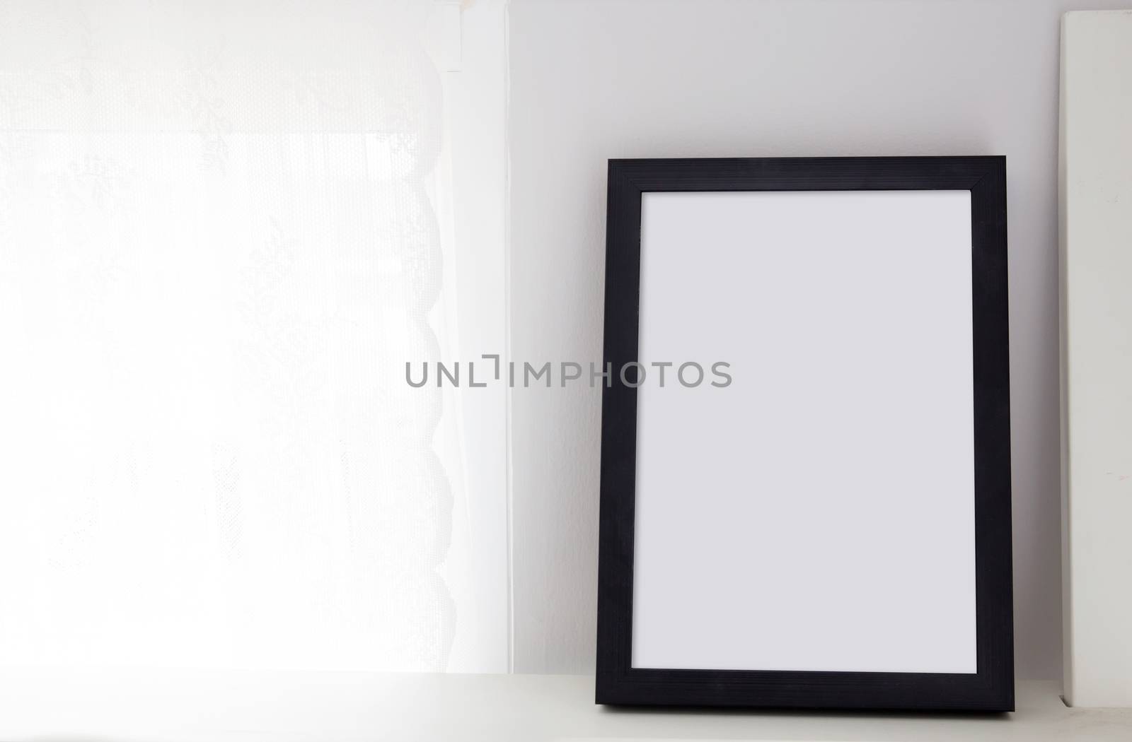 Empty black frame with place for text of on table. Scandinavian  by nnudoo