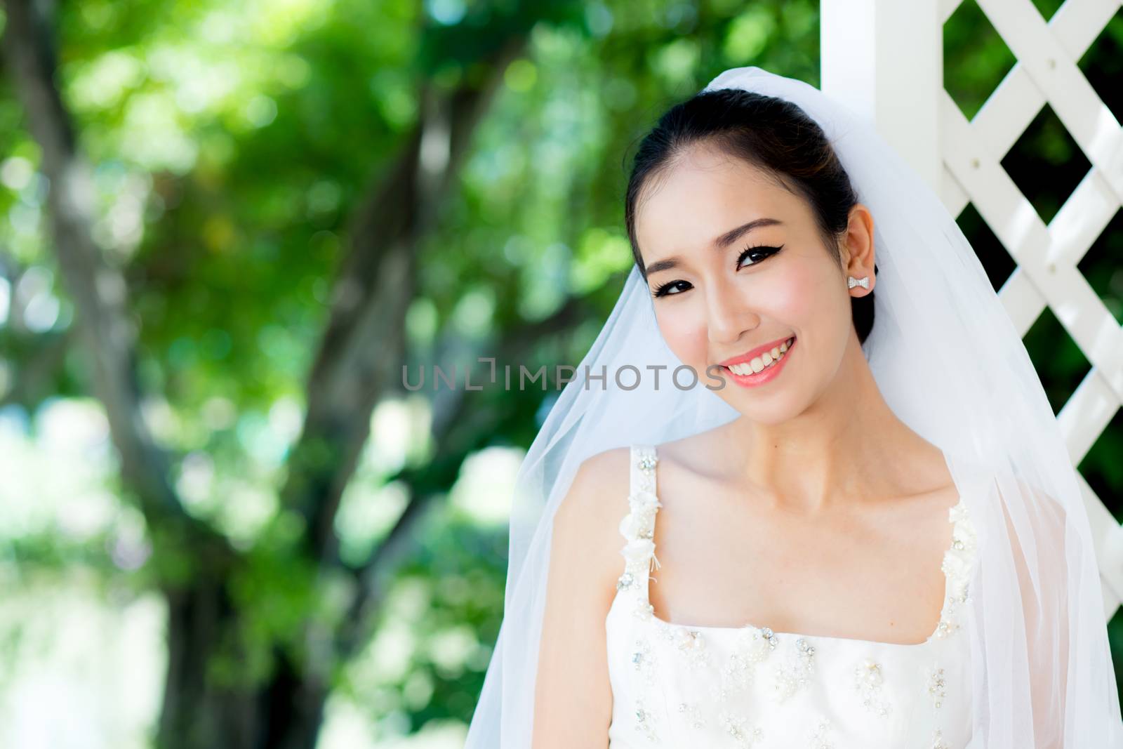 Asian bride at outdoor in a morning.
