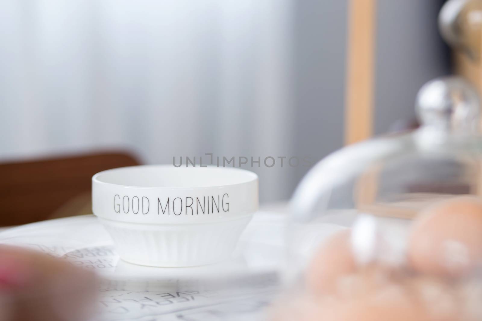 bowl with good morning text on table in morning day by nnudoo
