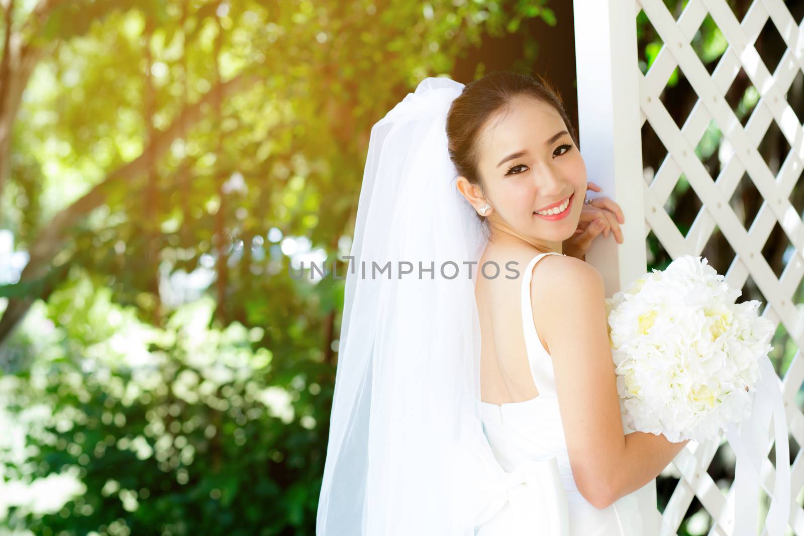 Asian woman bride at outdoor in a morning. by nnudoo