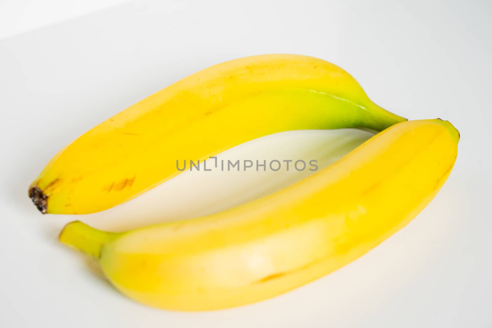 Two bananas against a plain white background