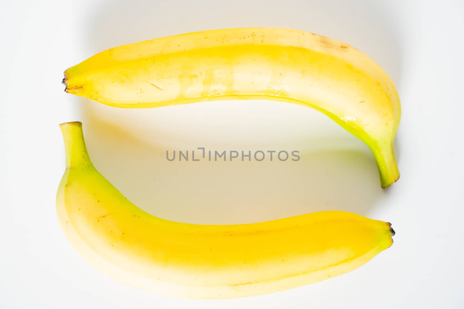 Two bananas against a plain white background