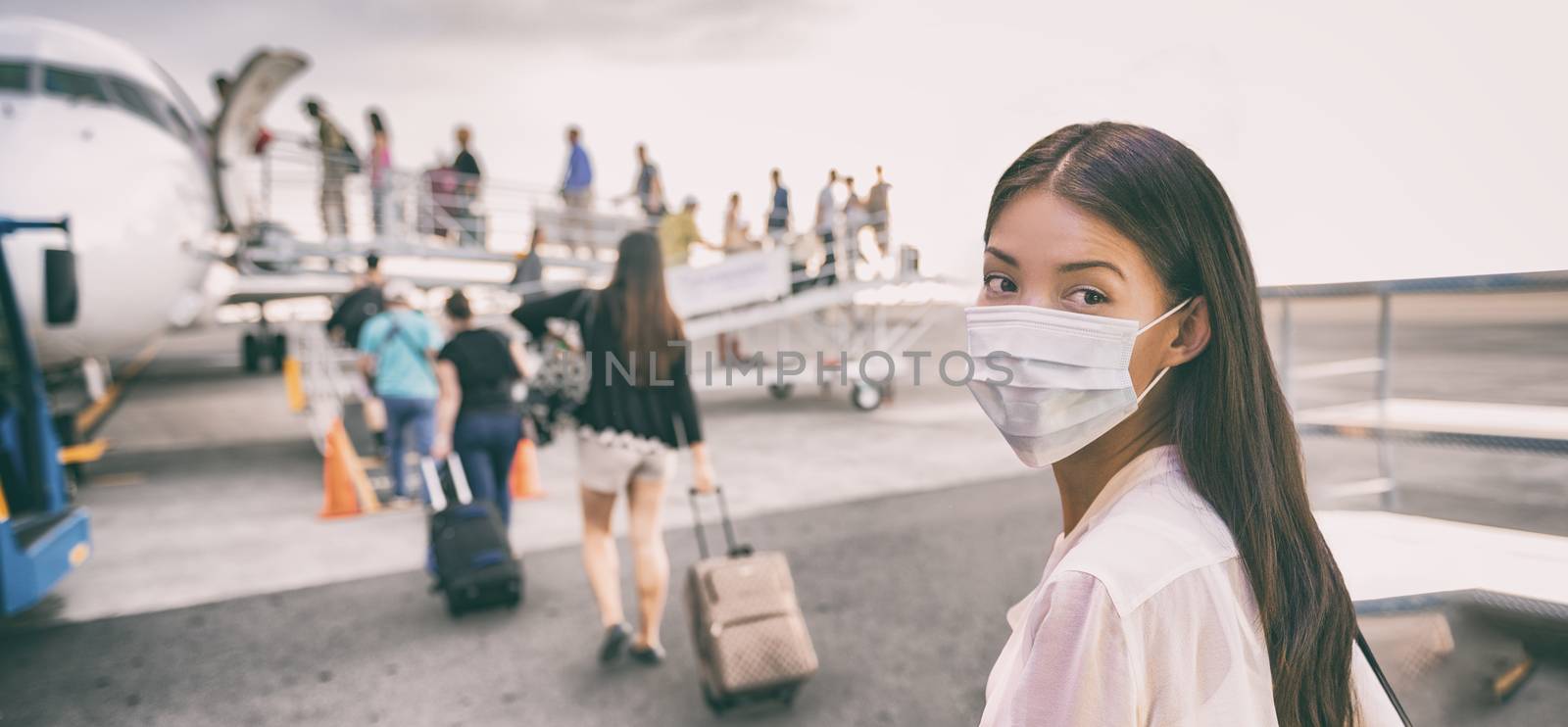Airport Asian woman tourist boarding plane taking a flight in China wearing face mask. Coronavirus flu virus travel concept banner panorama.