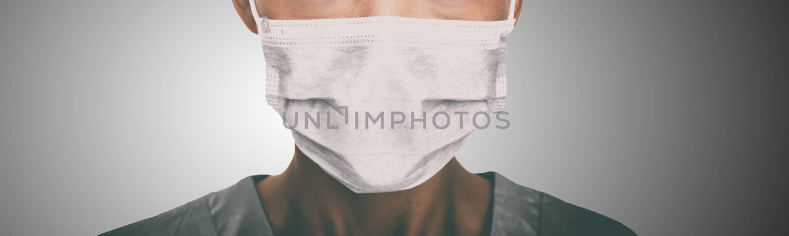 Doctor wearing protection face mask against coronavirus. Banner panorama medical staff preventive gear.