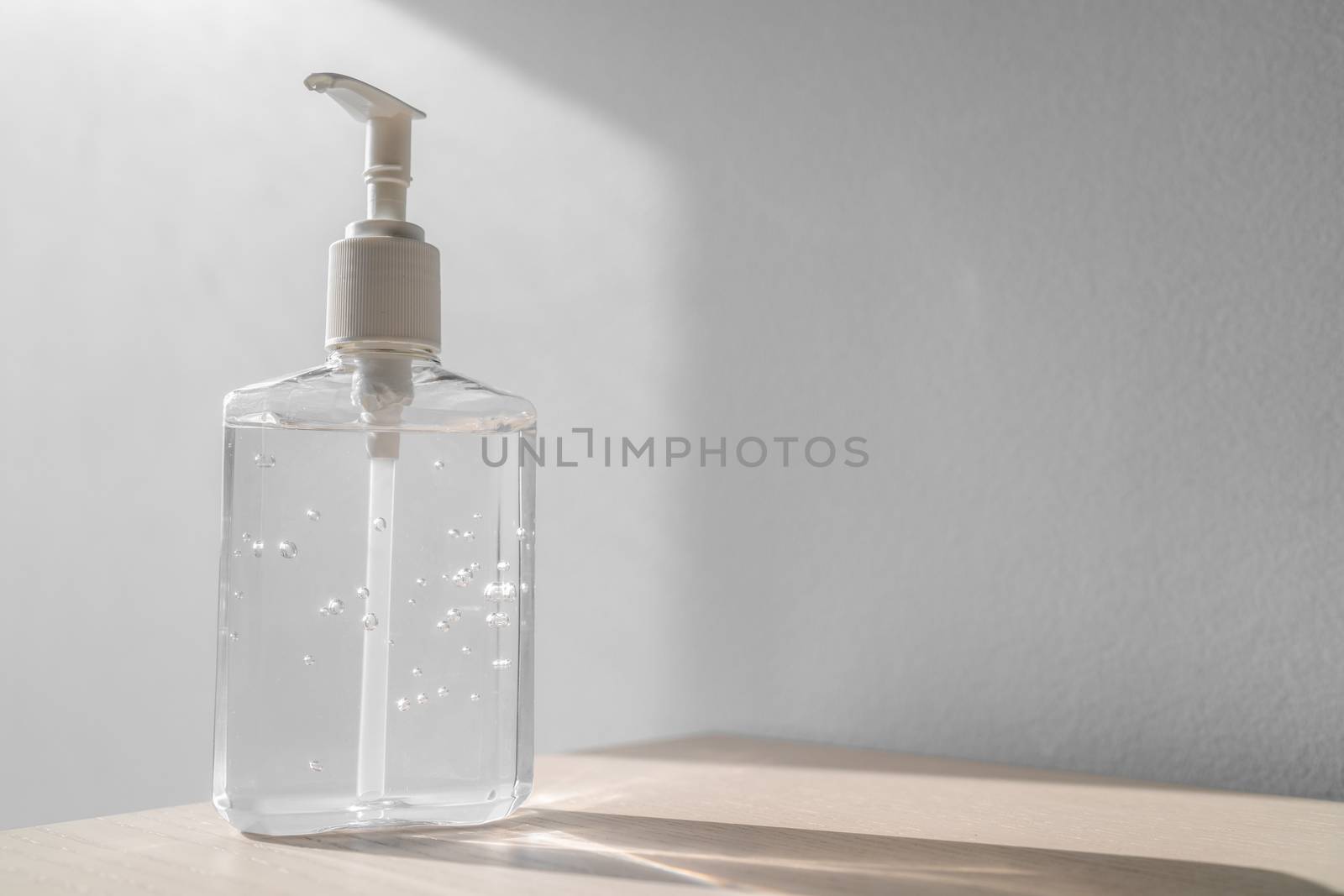 Coronavirus hand sanitizer bottle dispensing rubbing alcohol gel for hands hygiene health care prevention. Corona virus outbreak pandemic sanitiser background by Maridav
