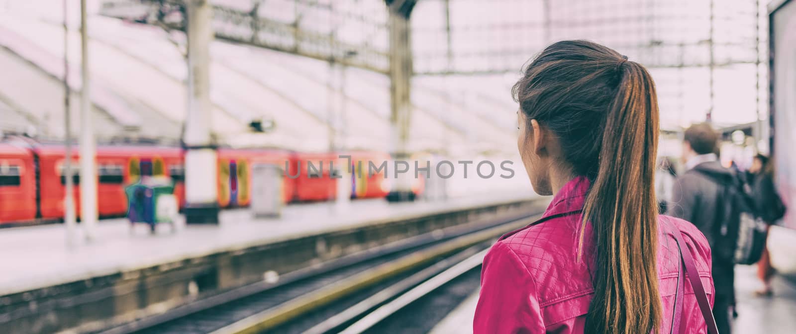 Train commuter woman going to work waiting for delayed tramway at station early morning panoramic banner background.