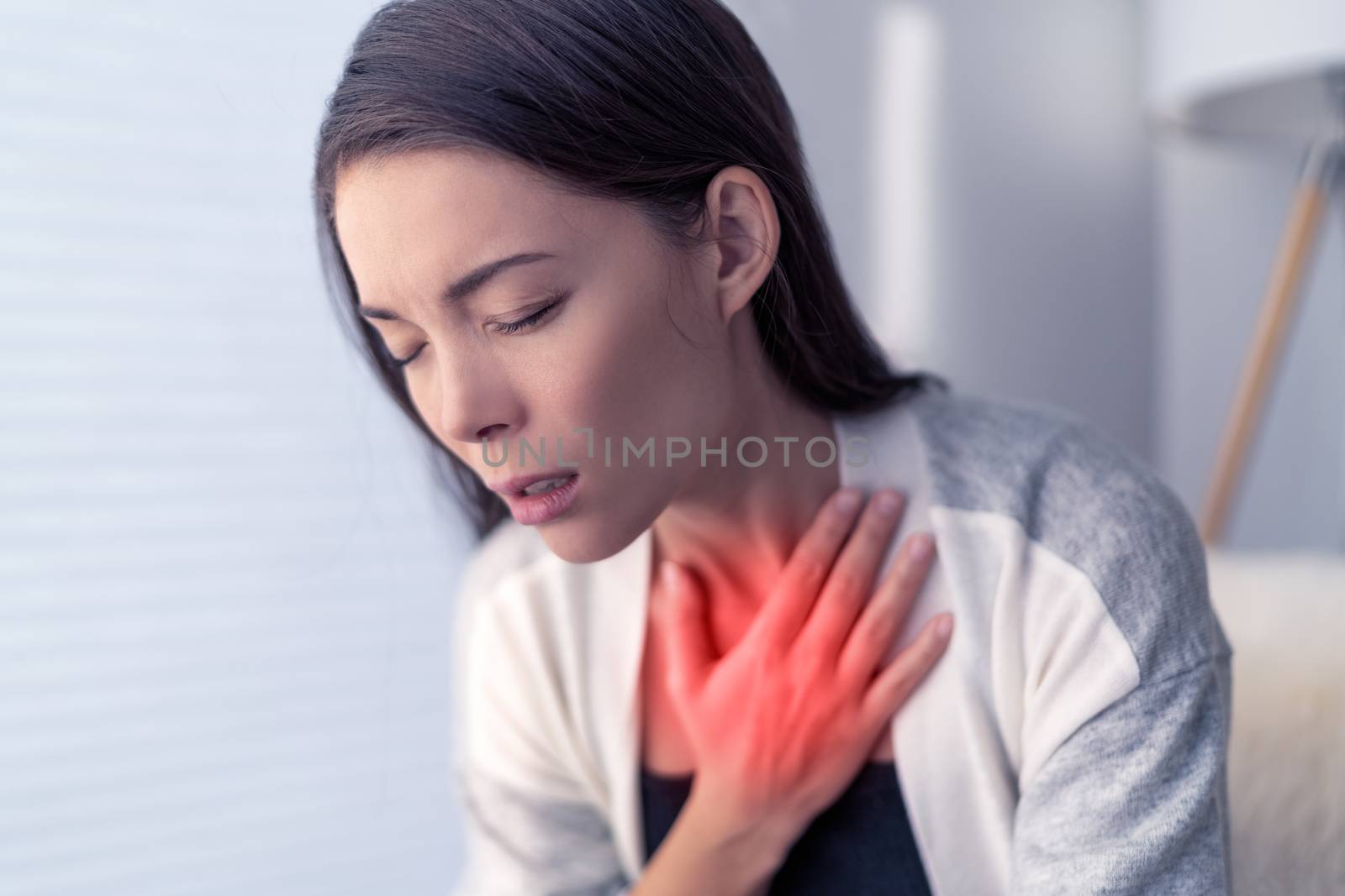 COVID-19 shortness of breath Coronavirus cough breathing problem. Asian woman touching chest in pain with red highlighted area. respiratory symptoms fever, coughing, body aches.
