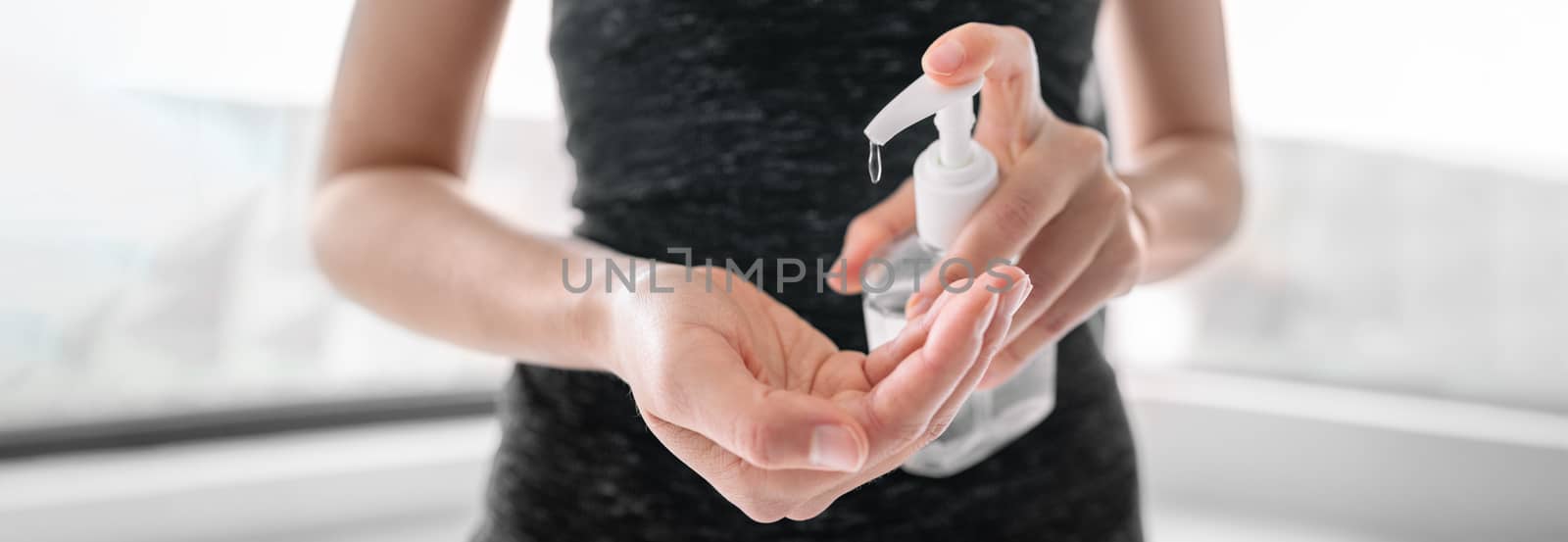 COVID-19 Hand sanitizer rubbing hands woman applying sanitizing gel liquid clean personal hygiene coronavirus pervention at home. Sanitiser bottle banner header by Maridav