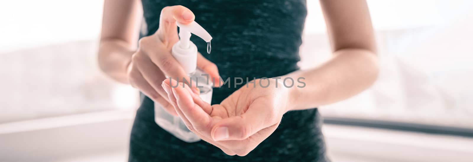 COVID-19 Hand sanitizer rubbing hands woman applying sanitizing gel liquid clean personal hygiene coronavirus pervention at home. Sanitiser bottle banner header by Maridav