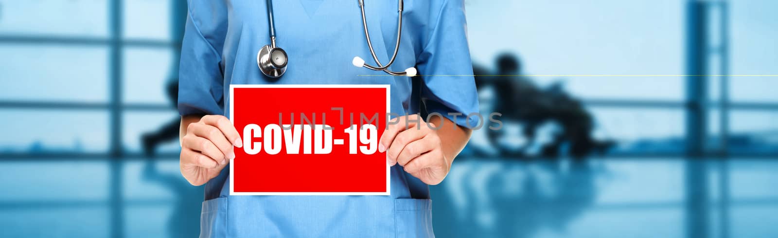 COVID-19 Coronavirus doctor holding sign in hospital banner background. Panoramic medical worker showing corona virus sign panoramic banner with text title by Maridav