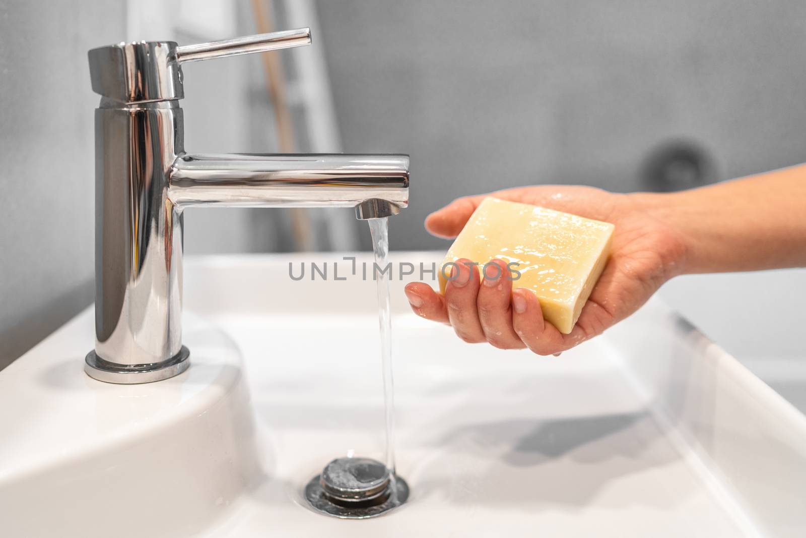 Corona virus washing hands with soap bar at home COVID-19 prevention. Hand hygiene for coronavirus outbreak. Protection by hand wash handwashing.