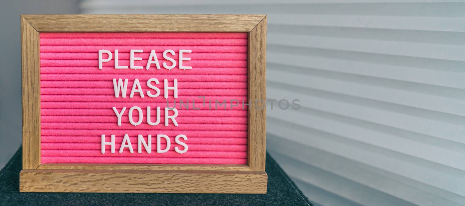 COVID-19 handwashing hand hygiene coronavirus message text for washing your hands. Corona virus felt board sign with letters PLEASE WASH YOUR HANDS by Maridav