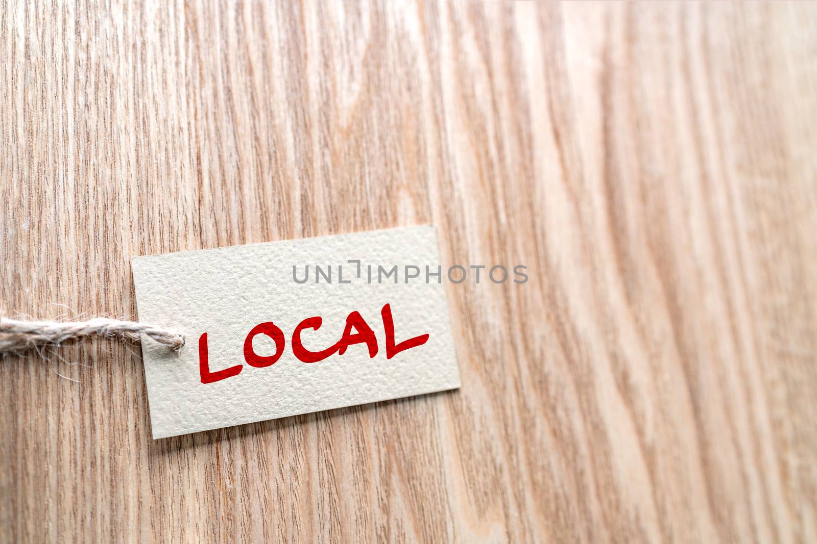 LOCAL handwritten paper gift box label on brown wood texture background , for buying locally small economy by Maridav