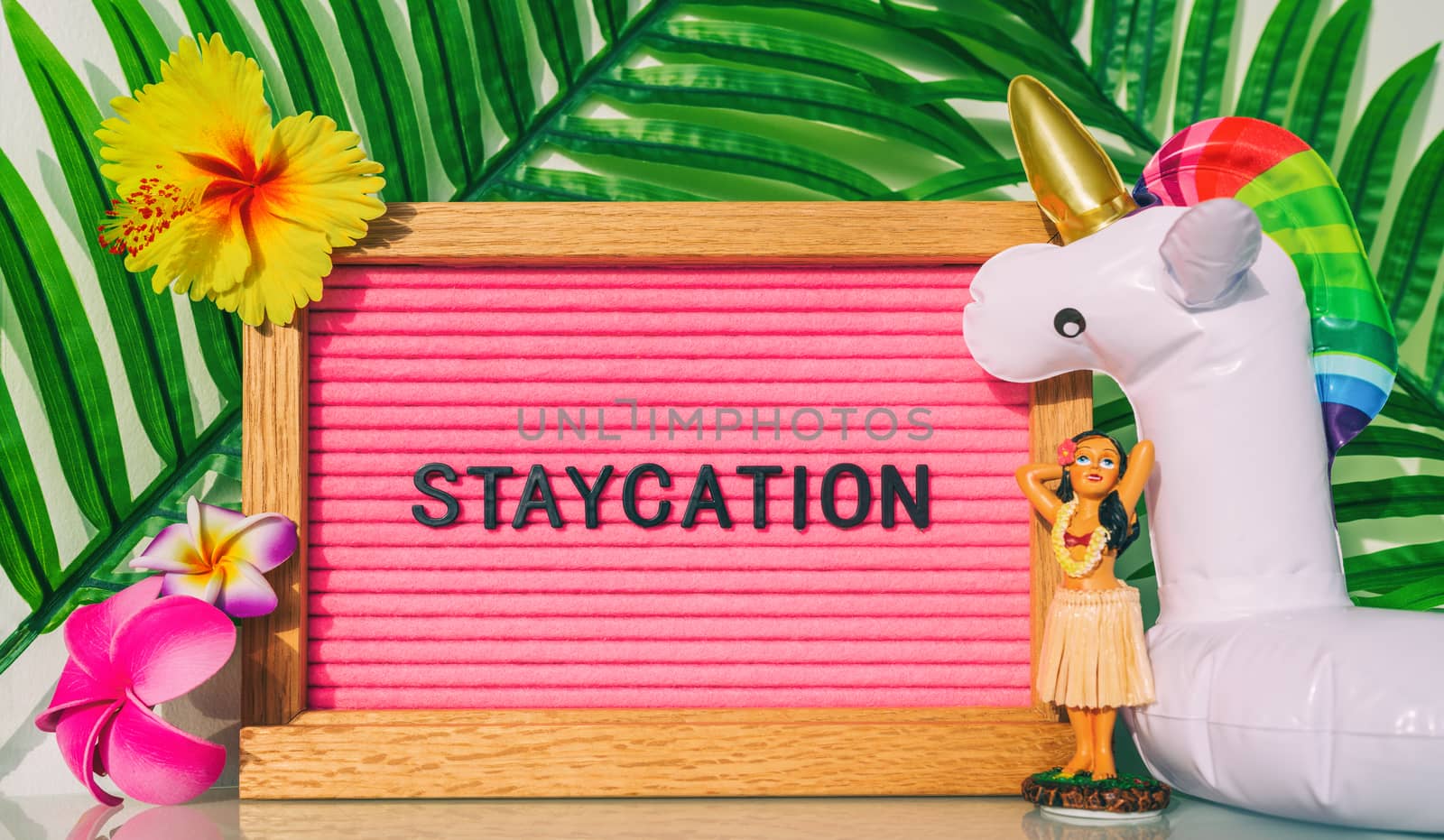 Staycation sign for summer vacation plans during COVID-19. Funny vintage hawaiian pink felt board text for staying home for the holidays. What to do this summer without travel by Maridav