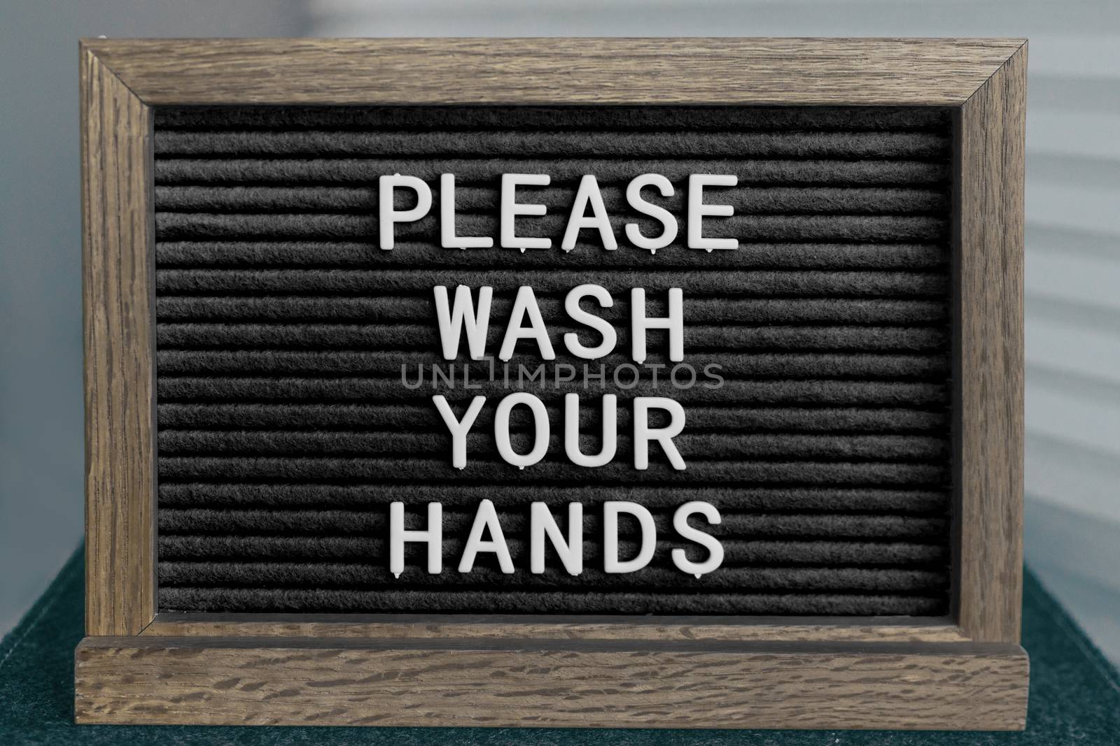 COVID-19 washing hands coronavirus spreading prevention message of handwashing hand hygiene corona virus text for washinghands.BLACK board sign with letters PLEASE WASH YOUR HANDS by Maridav