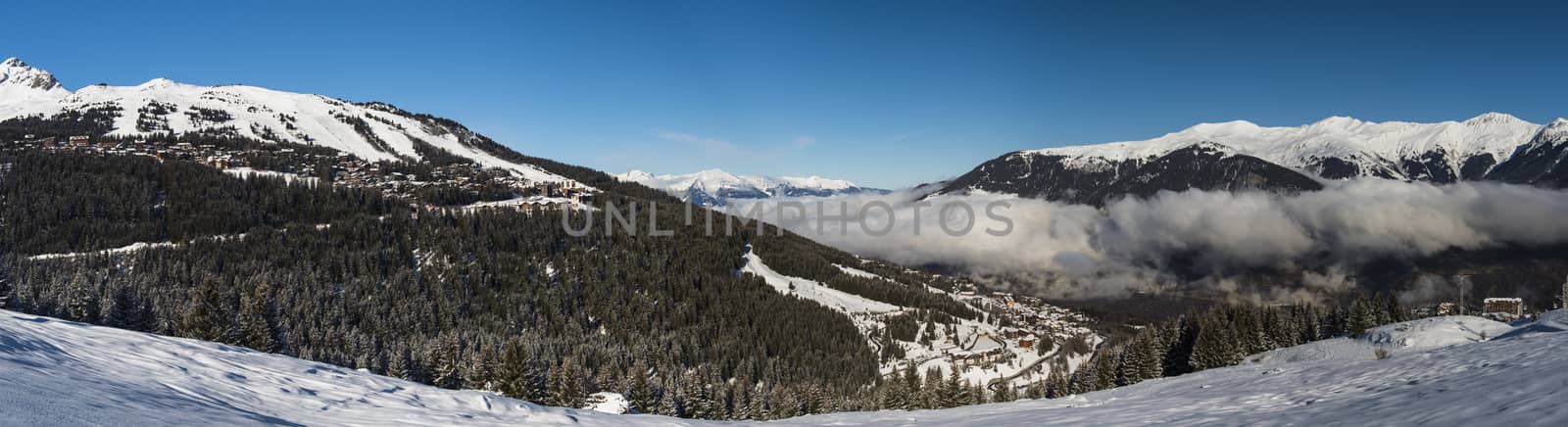 Panoramic view down an alpine mountain valley by paulvinten