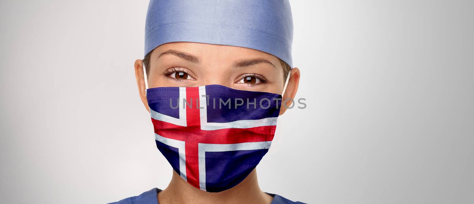 Icelandic flag Iceland COVID-19 panoramic banner Corona virus outbreak pandemic doctor woman wearing PPE protective face mask for coronavirus prevention. Asian nurse happy. Health care worker helping by Maridav