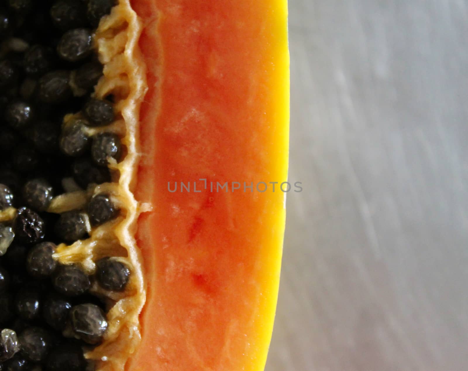 Close up of papaya seeds and mesocarp. Papaya fruit.