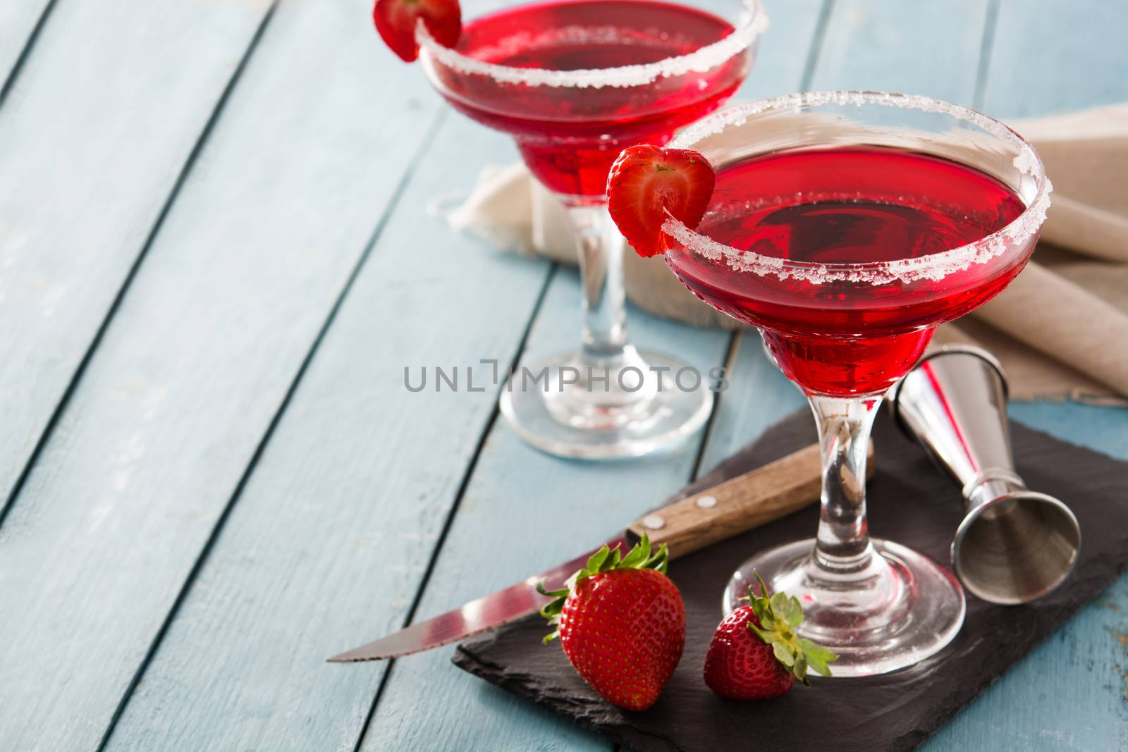 Strawberry cocktail drink in glass isolated on white background