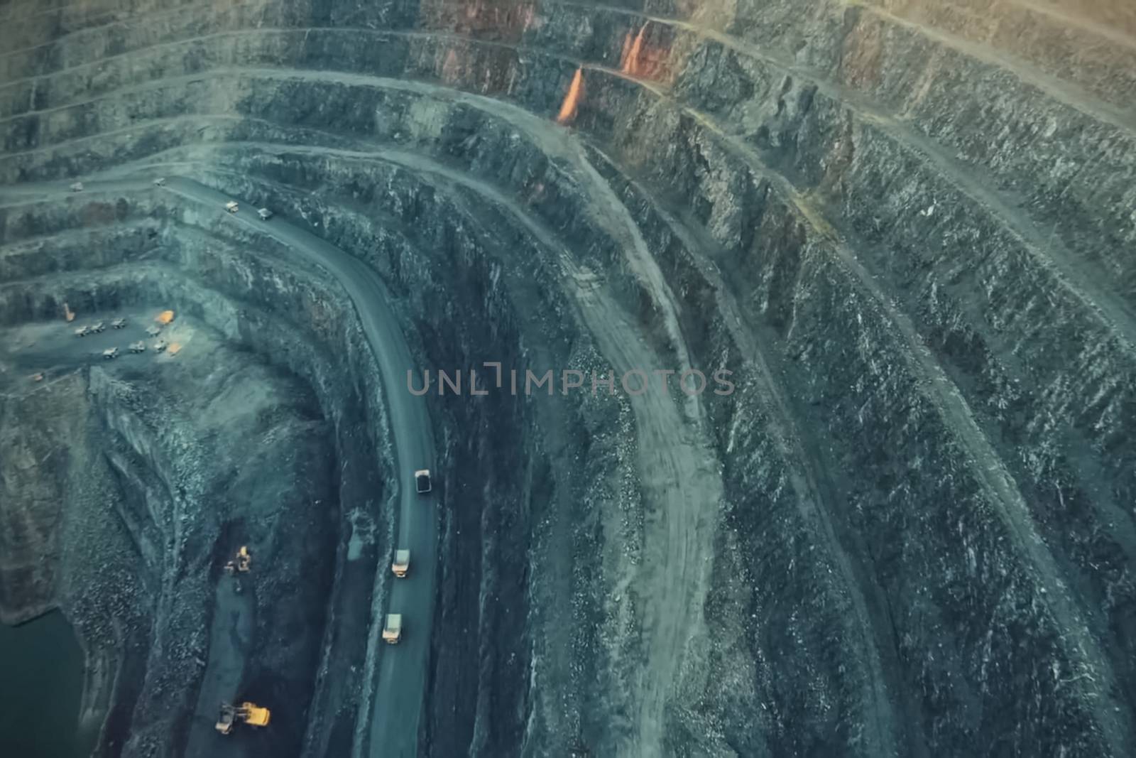 A big quarry for gold mining. The technique is in the car.